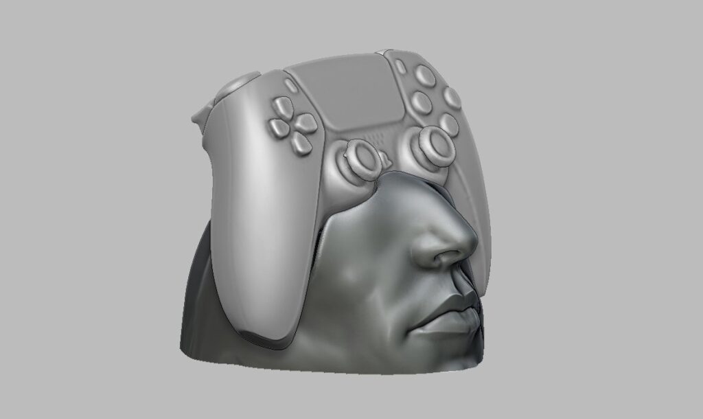 人間の顔をモチーフにした、PS5コントローラー用のユニークな3Dプリントスタンドの画像。