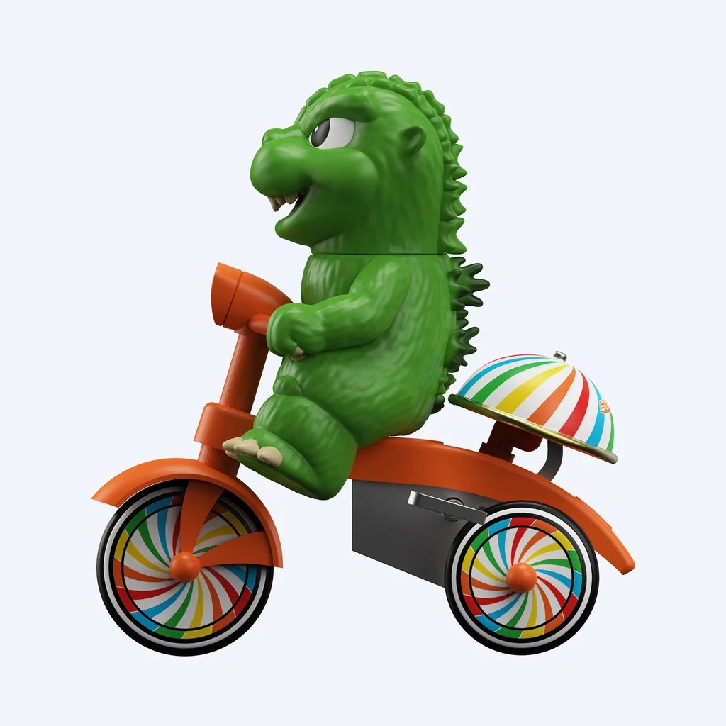 Super7が展開する「Super Cycles」シリーズから登場した、グリーンのゴジラが赤いゼンマイ式三輪車に乗ったフィギュア「Super7 Super Cycles - Godzilla (Green w/ Red Trike)」の画像。
